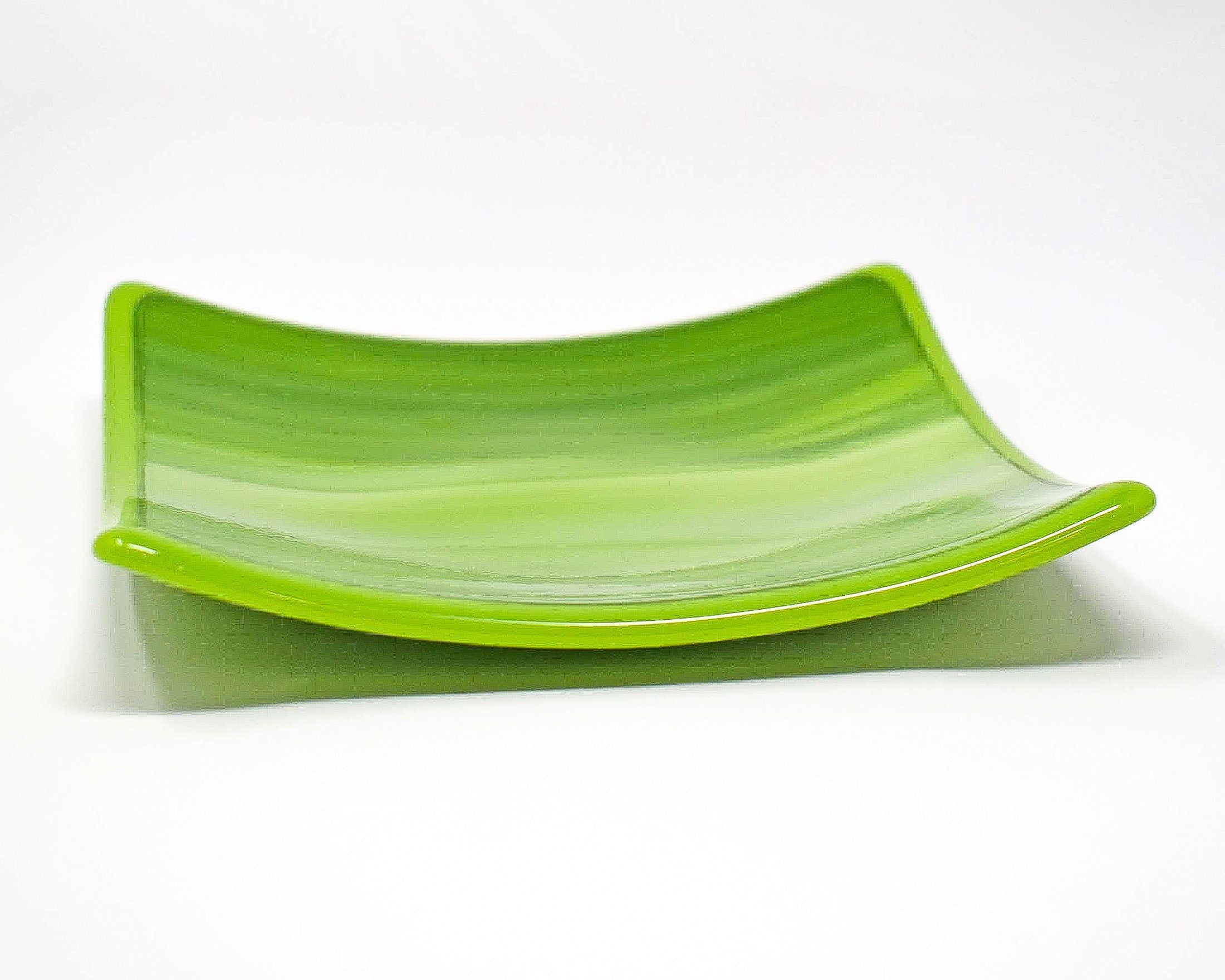 A green square glass dish against a white background. The dish has a light lime green and white striped pattern.