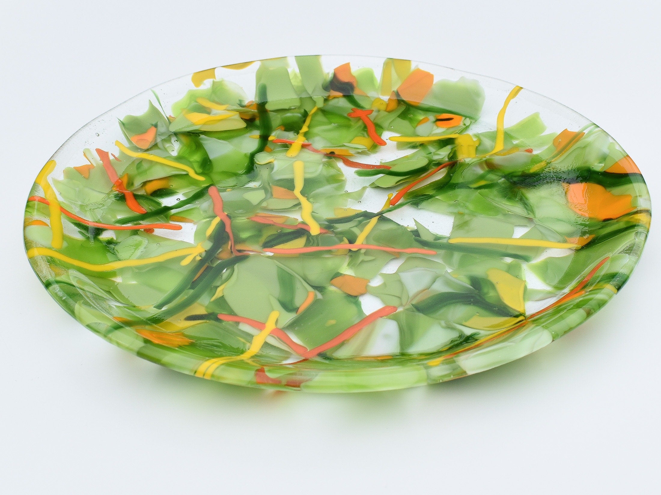 Large round glass tray in lime green, orange, yellow and red.