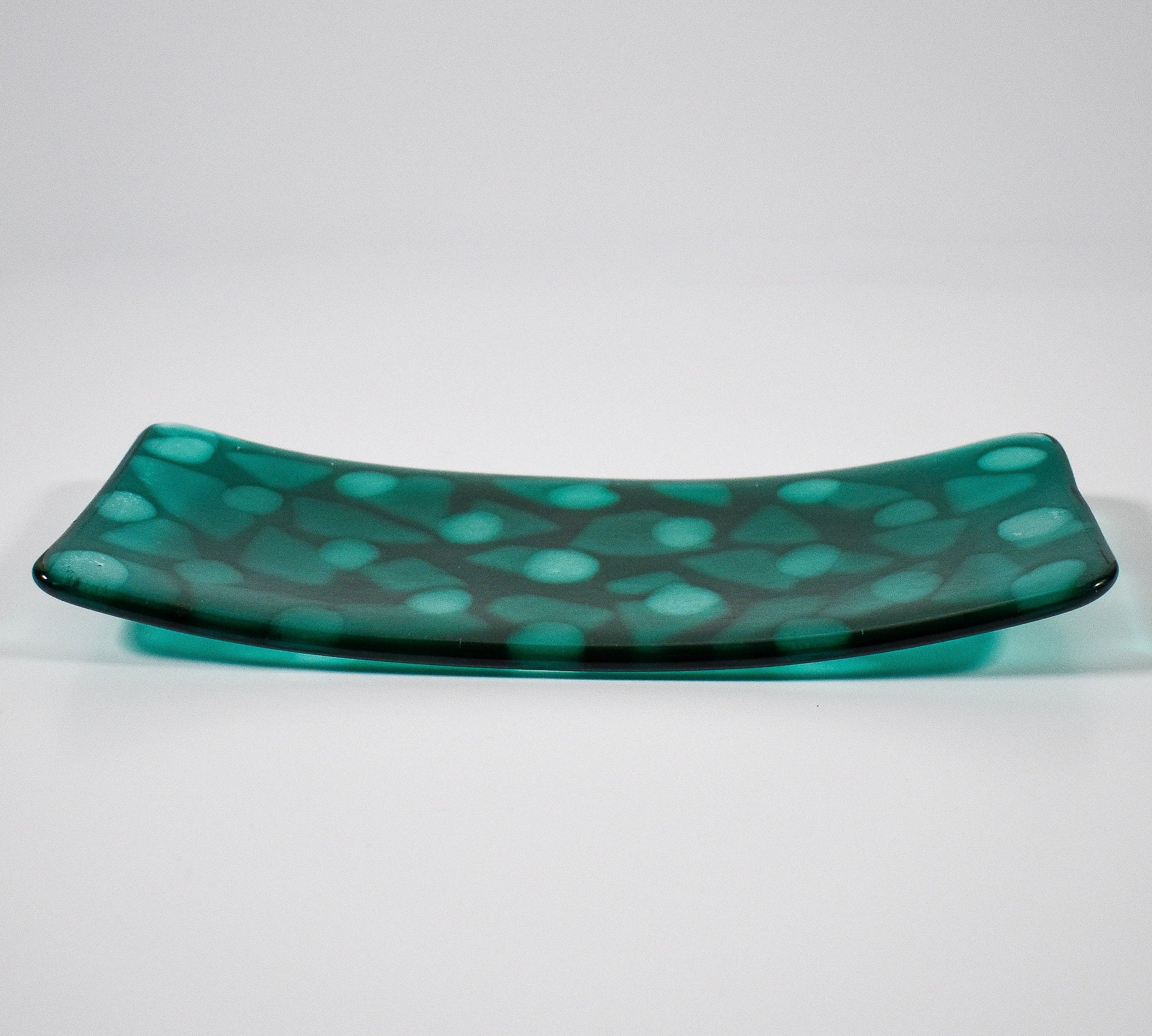 Teal green rectangular glass tray with diffused clear dot pattern