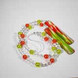 Glass Wind Chime in Summer Colors for Patio, Porch, Garden or Balcony coiled on white background.