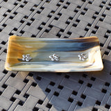 Rectangular glass tray made with streaky glass in gold, cream, tan, brown and gray with floral design