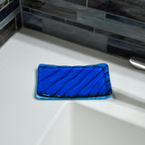 Aqua blue soap dish, rectangular, with wave design.