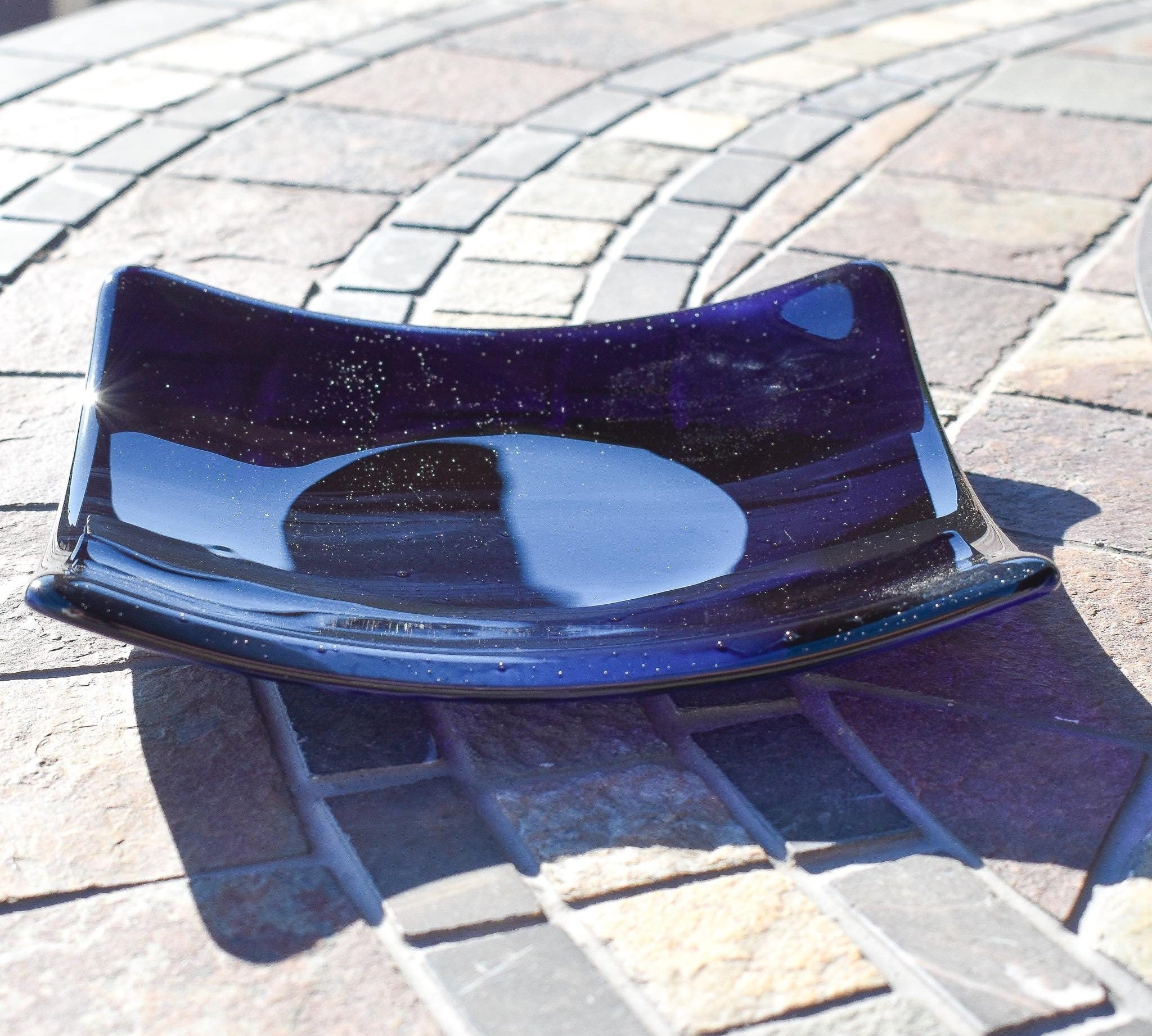 Deep transparent purple and white streaky glass formed into a 6&quot; square slightly sloped dish.