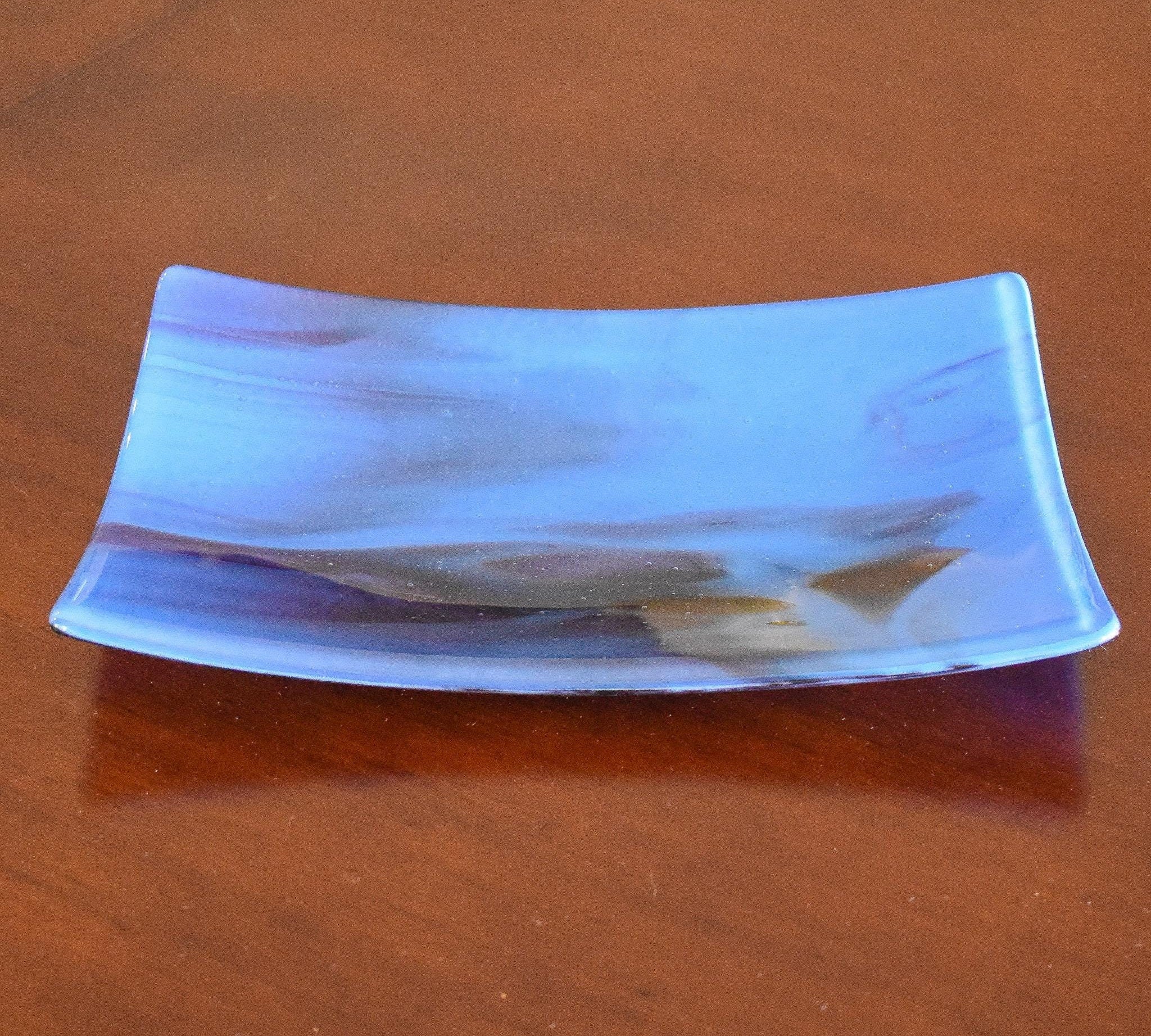 Rectangular glass tray with slightly sloped corners in medium blue with plum purple streaks.