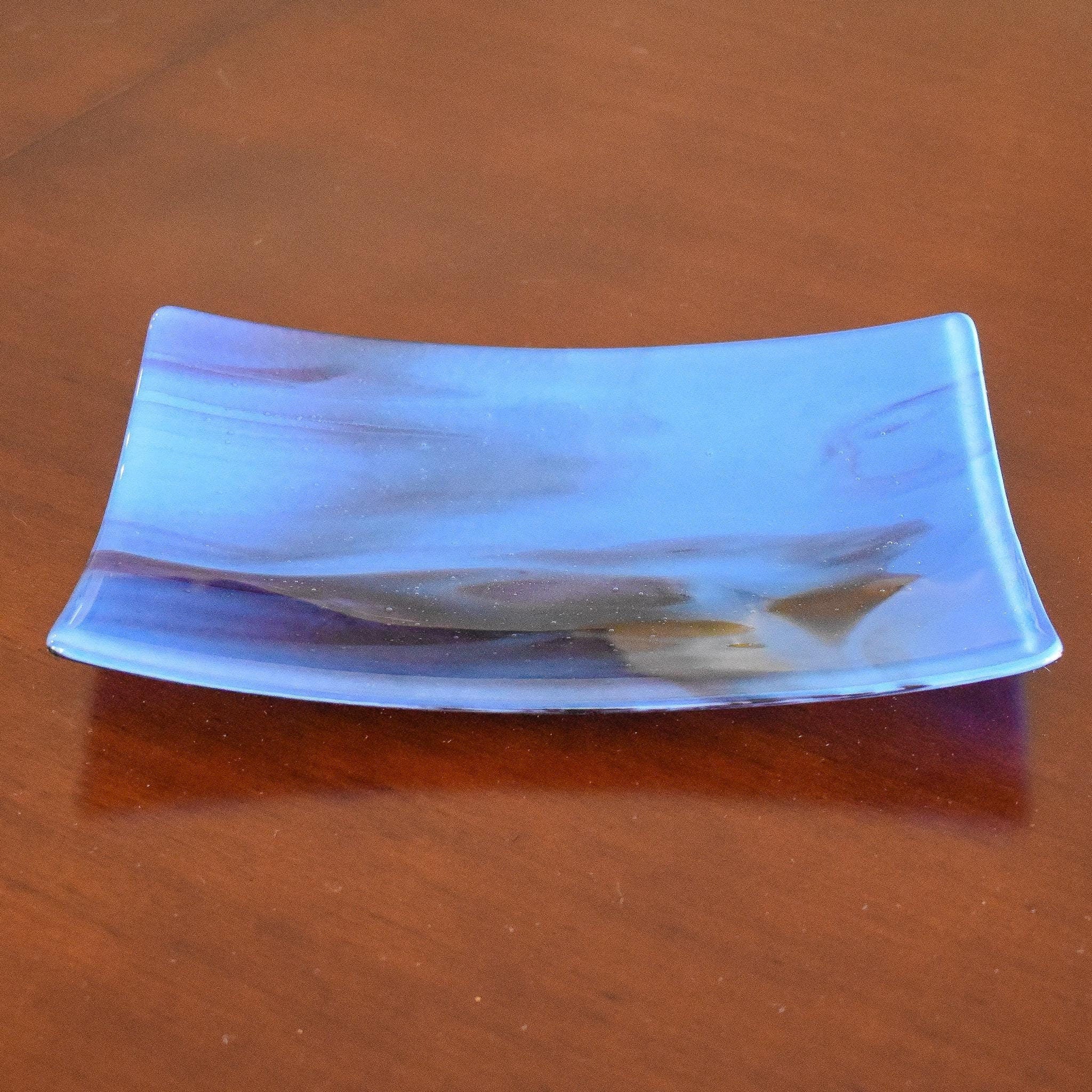 Rectangular glass tray with slightly sloped corners in medium blue with plum purple streaks.