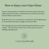 Written description of how to enjoy your Cinjo Chime, including choosing a place away from heavy structures and draping the wire over a nail, hook or tree branch. Cinjo Handmade logo is at the bottom.