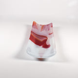 End view in softer lighting showing the raised sides and the red swirl inside the channel.