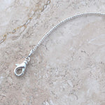 Close up photo of lobster clasp used in Cinjo Handmade small sun catchers.