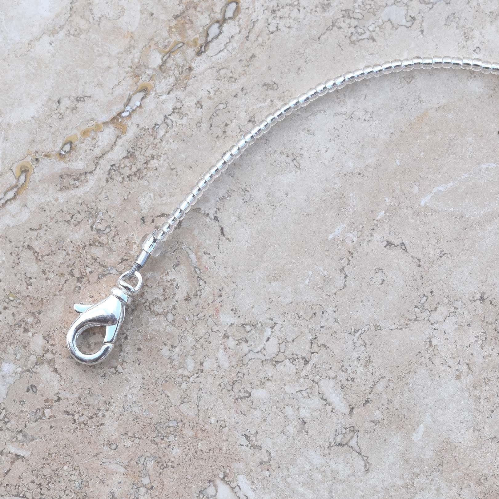 Close up photo of lobster clasp used in Cinjo Handmade small sun catchers.