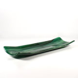 Front view of a 12-inch green fused glass channel tray with lifted sides and a smooth glossy finish on white.