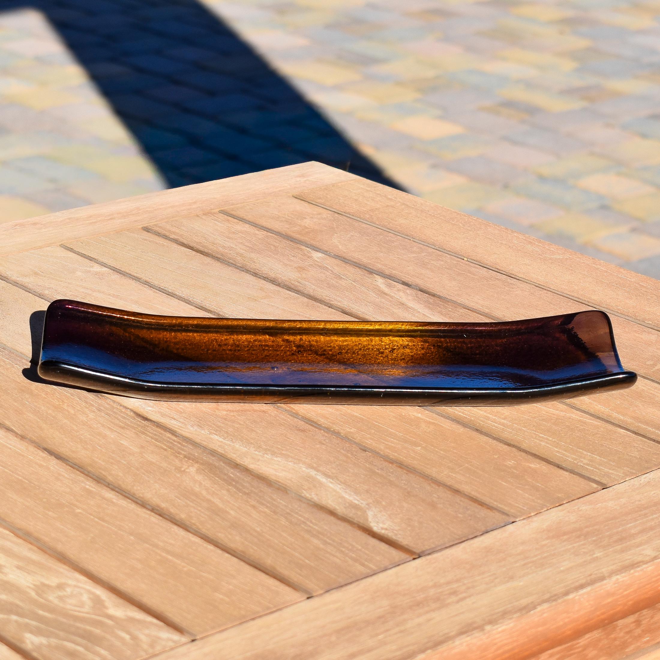 Front end view of the tray showing the shallow trough profile and translucent gold-to-purple gradient.