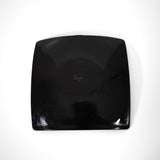 The black underside of square shaped fused glass tray.