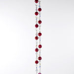 Large cranberry red jade stones beaded with glass and crystals, anchored by two pieces of dark cranberry pink fused glass, hanging vertically against white background.