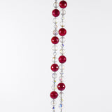 Large cranberry red jade stones beaded with glass and crystals, hanging vertically against white background.
