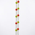 Two strands of clear beads with alternating orange and green beads hanging vertically against white background.