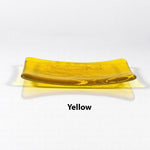 Glass soap dish in transparent yellow glass with swimming fish design.