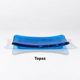 Glass soap dish in transparent Topaz Blue glass with swimming fish design.