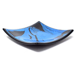 Six inch square glass tray. Center of tray is a medium blue with black streaks. Trim is solid black. On white background.