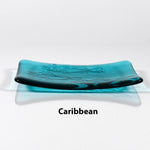 Glass soap dish in transparent Caribbean Blue glass with swimming fish design.