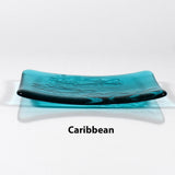 Glass soap dish in transparent Caribbean Blue glass with swimming fish design.