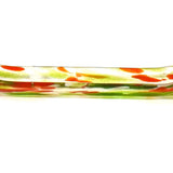 A long, rectangular glass dish with a curved shape. The dish is clear with green and orange color accents. The green is in the form of streaks and the orange is in the form of small, irregular shapes. The dish is likely used for serving or display purposes.